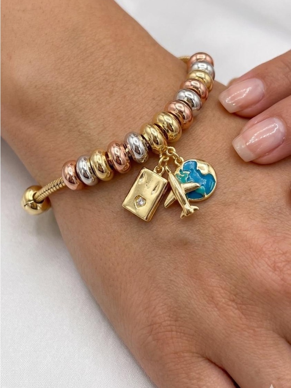 Gold Travel Charm Bracelet with Blue Globe Accent